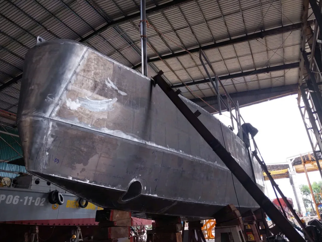 Hull section under construction in a hangar